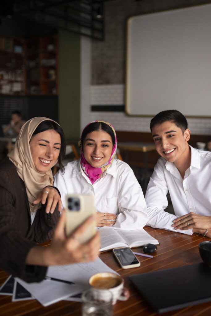 medium-shot-arab-friends-taking-selfie